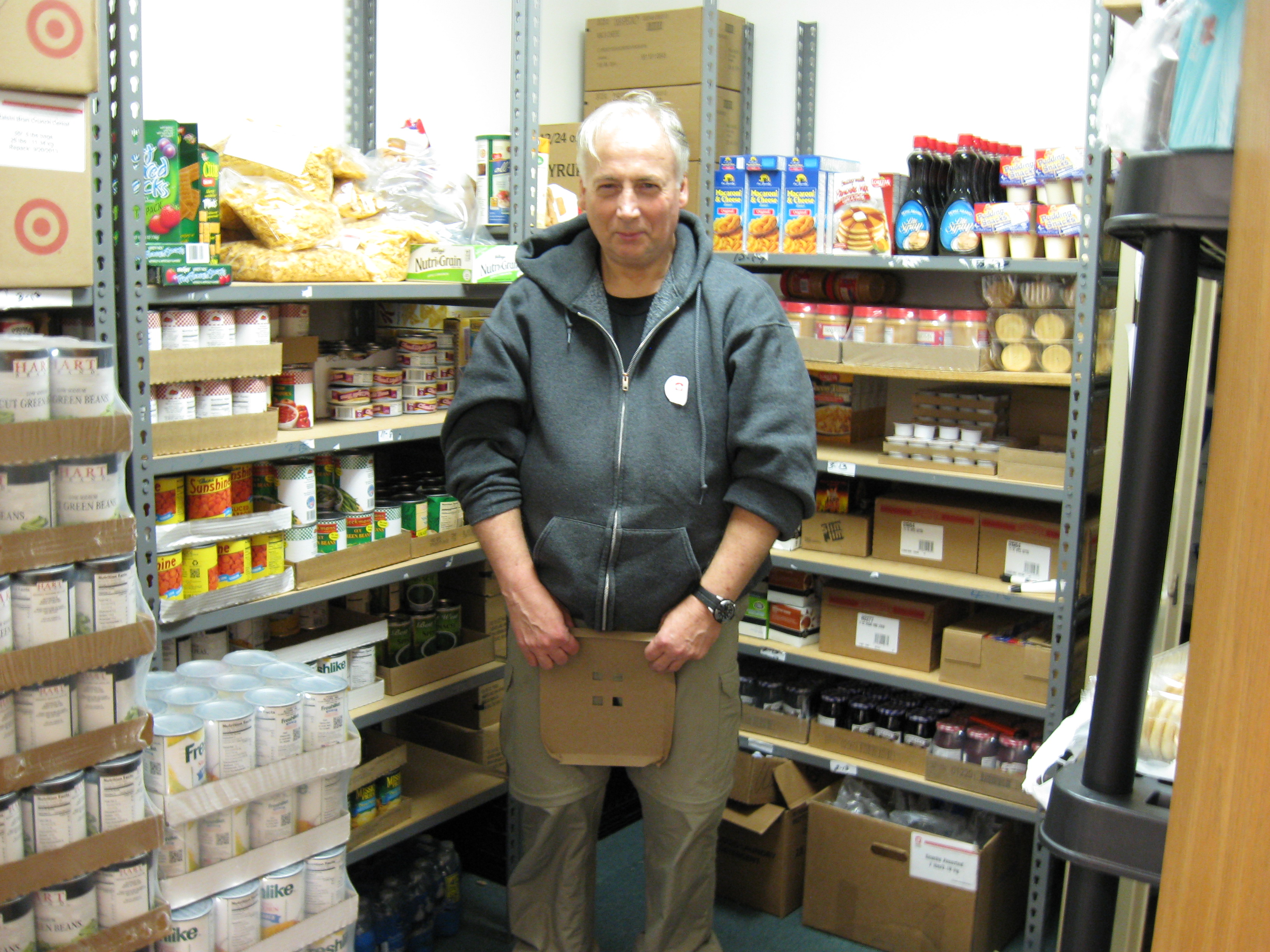 An RSVP Volunteer in the food pantry