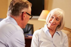 Therapist smiling at male client