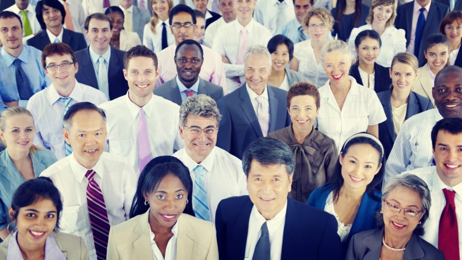 A large diverse crowd of business professionals